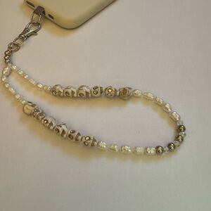 Cell phone wristlet from The Charm Hut works on any phone case